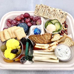 Compostable fiber bento box in foodservice setting