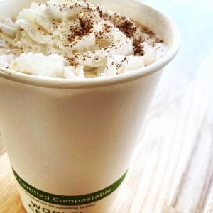 Pla-lined 12 oz compostable hot cup in foodservice setting